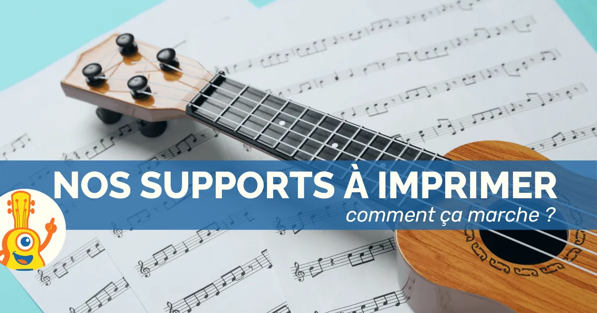 Ukulélé en bois posé sur des partitions imprimées, avec le texte "Nos supports à imprimer – comment ça marche ?"